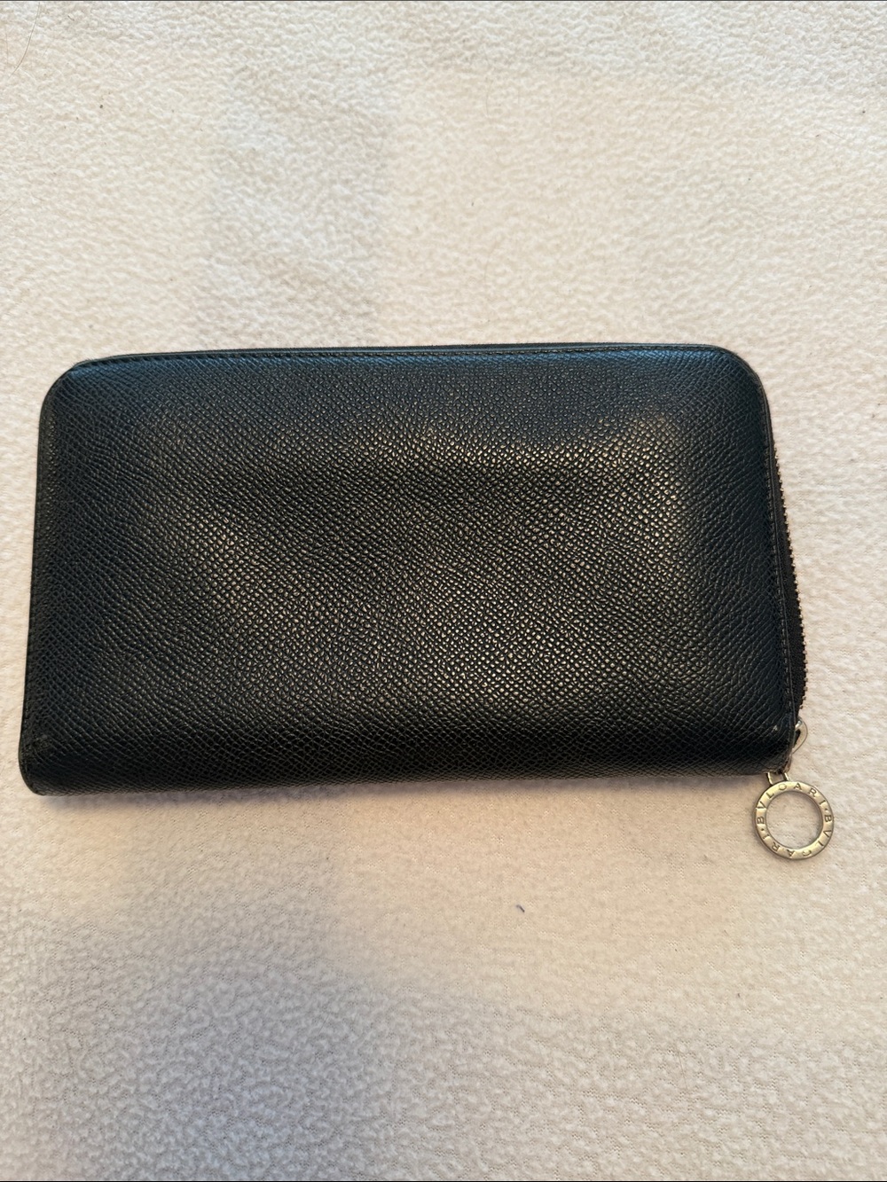 Bvlgari Zip-Around Black Leather wallet with blue interior.